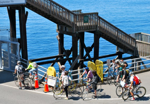 Cyclists getting on the Bainbridge Ferry, Seattle side in summer.