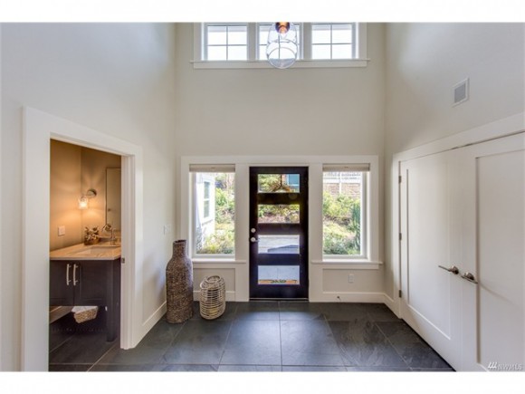 Gracious entry with slate tile and vaulted ceilings.